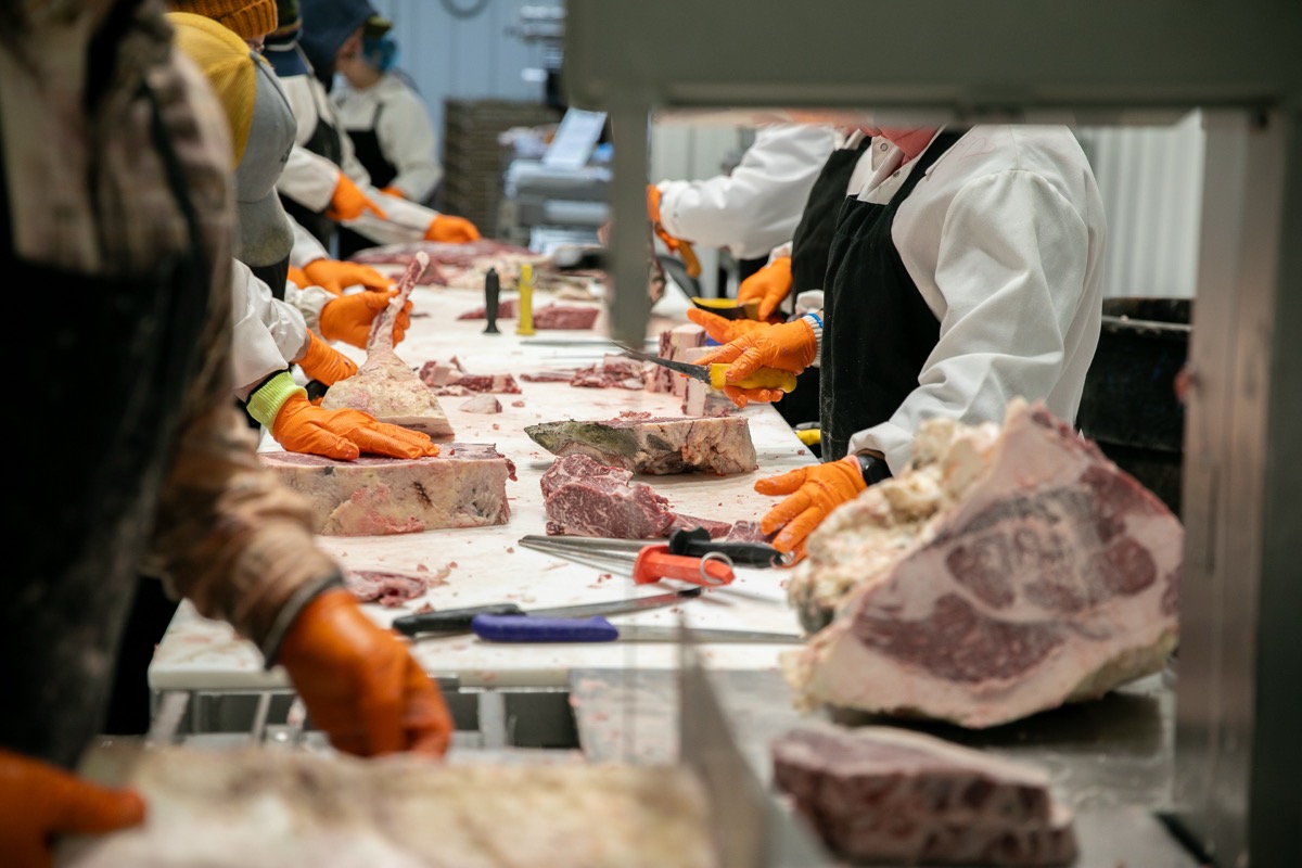 Our team hand-processing Akaushi Wagyu beef